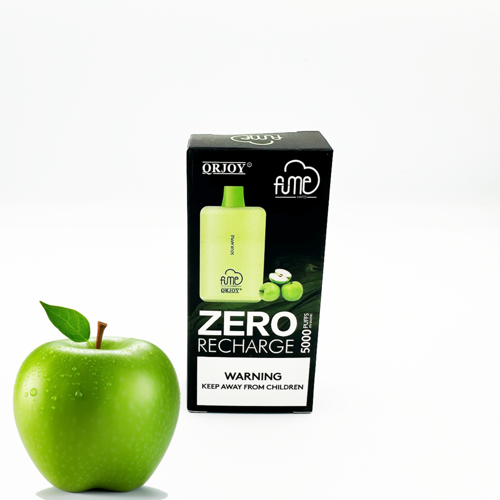 Fume recharge nicotine free disposable vape sour apple flavor in the package next to a green apple